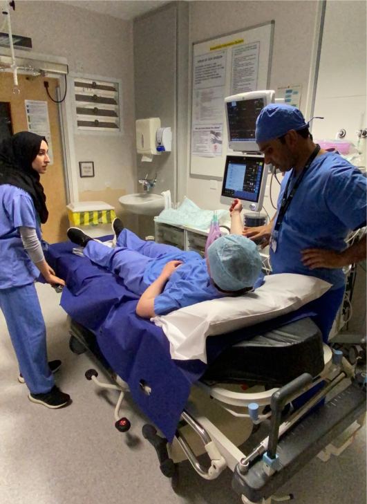 Medic teaching student in hospital